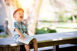 ben-white-Reading kid laughing reading